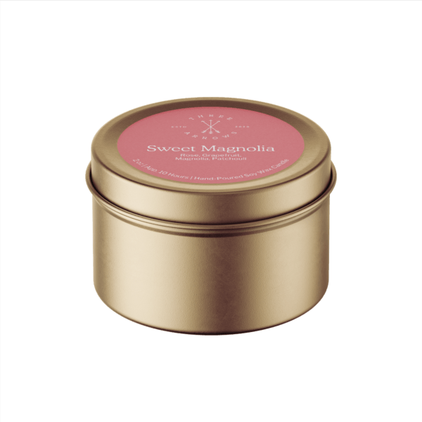 Sweet Magnolia candle in gold colored tin